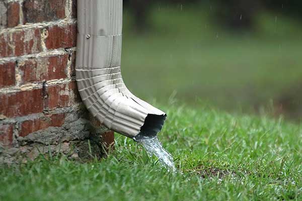improper positioning of downspouts can cause water infiltration